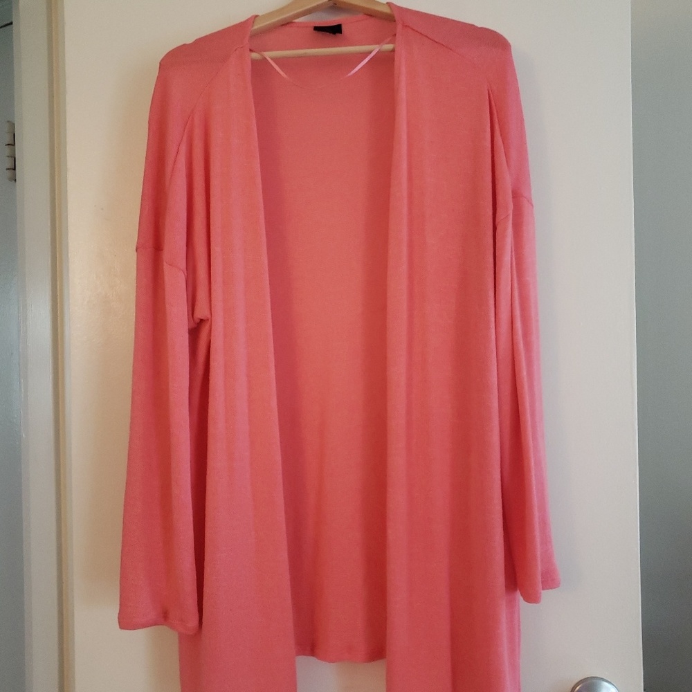 Oversized coral-colored cardigan